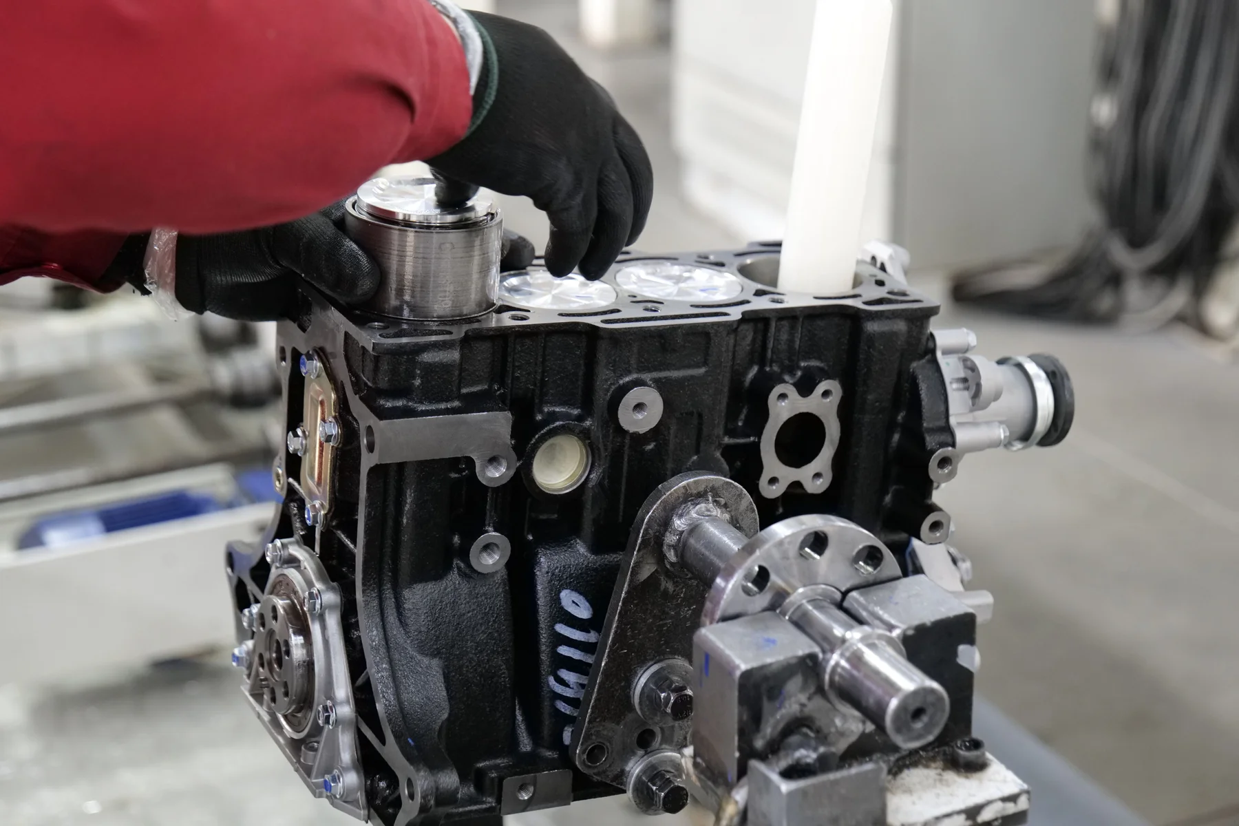 Close view of an engine block and precision-machined pistons