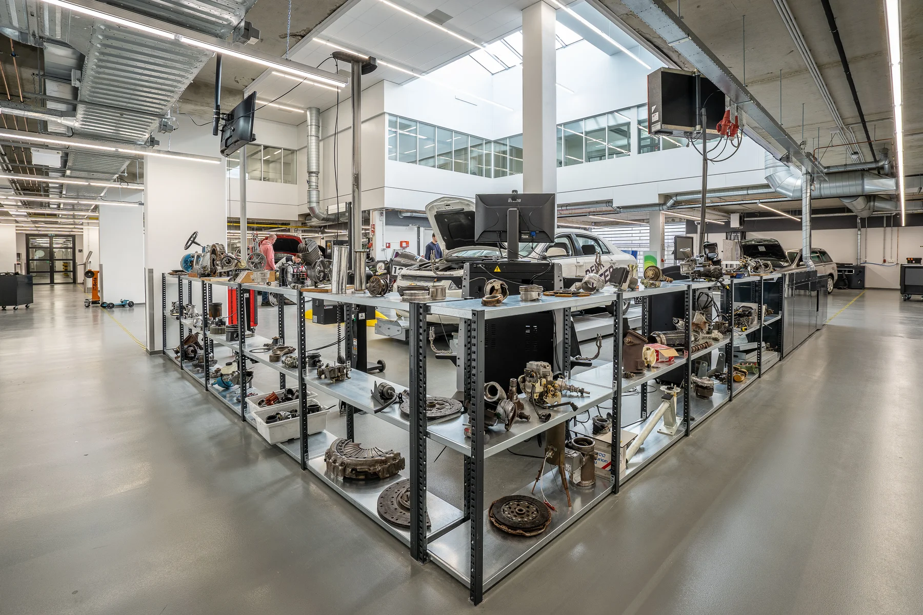 Mechanical automotive components on metal shelving